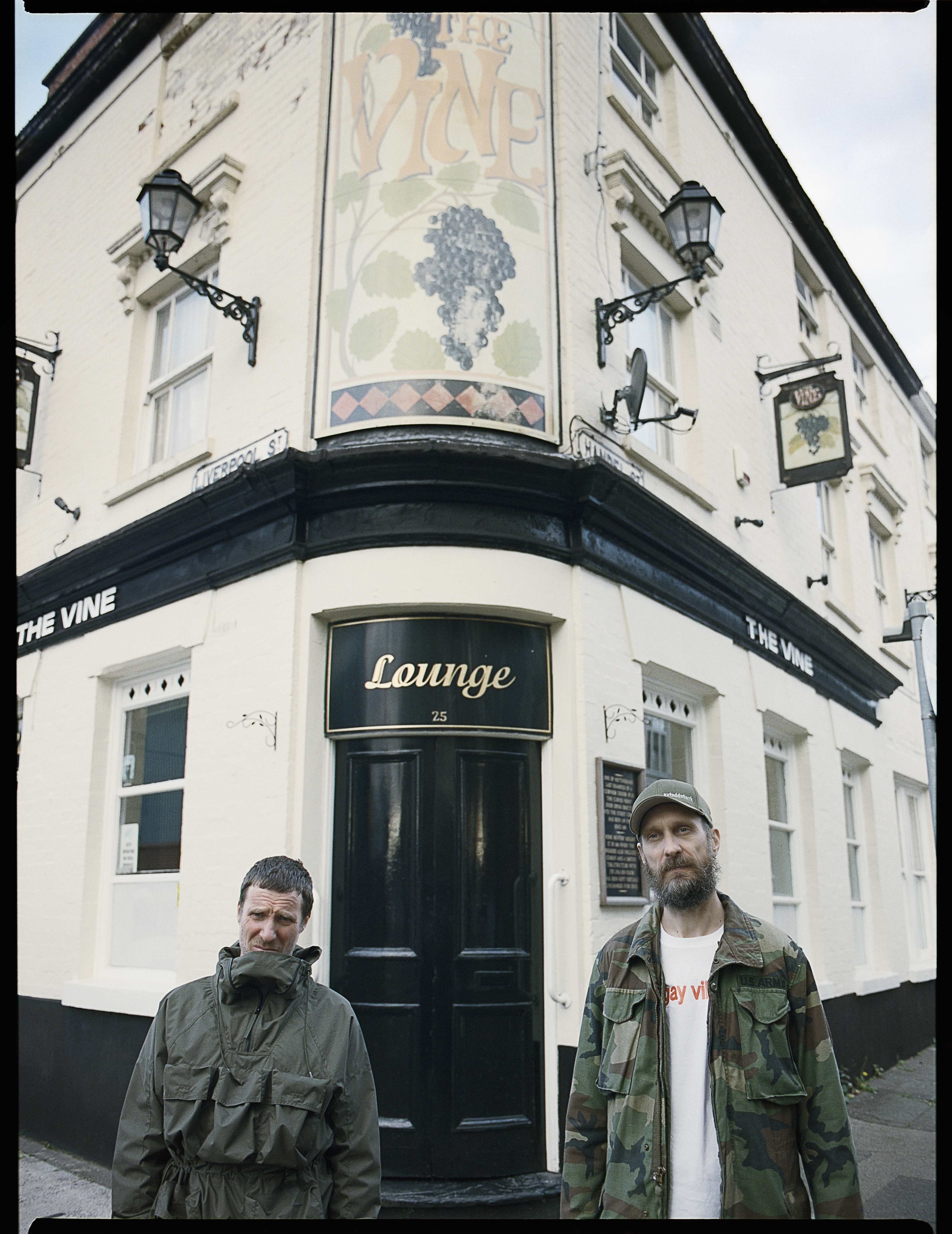 Sleaford Mods in front of a pub