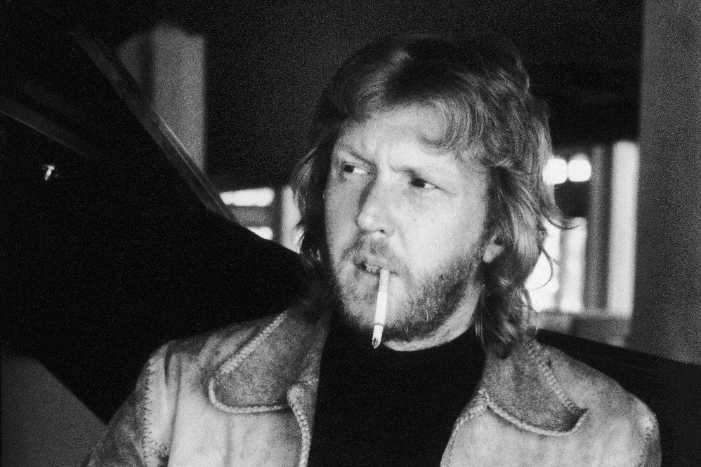American singer and songwriter Harry Nilsson (1941 - 1994) plays a ukelele while he smokes a cigarette, Hawaii, January 31, 1973. (Photo by Julian Wasser/The LIFE Images Collection via Getty Images/Getty Images)