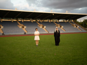 Evangeline Ling and David Wrench on a sports pitch