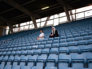 Evangeline Ling and David Wrench in a sports stadium