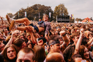 Crowdsurfing man