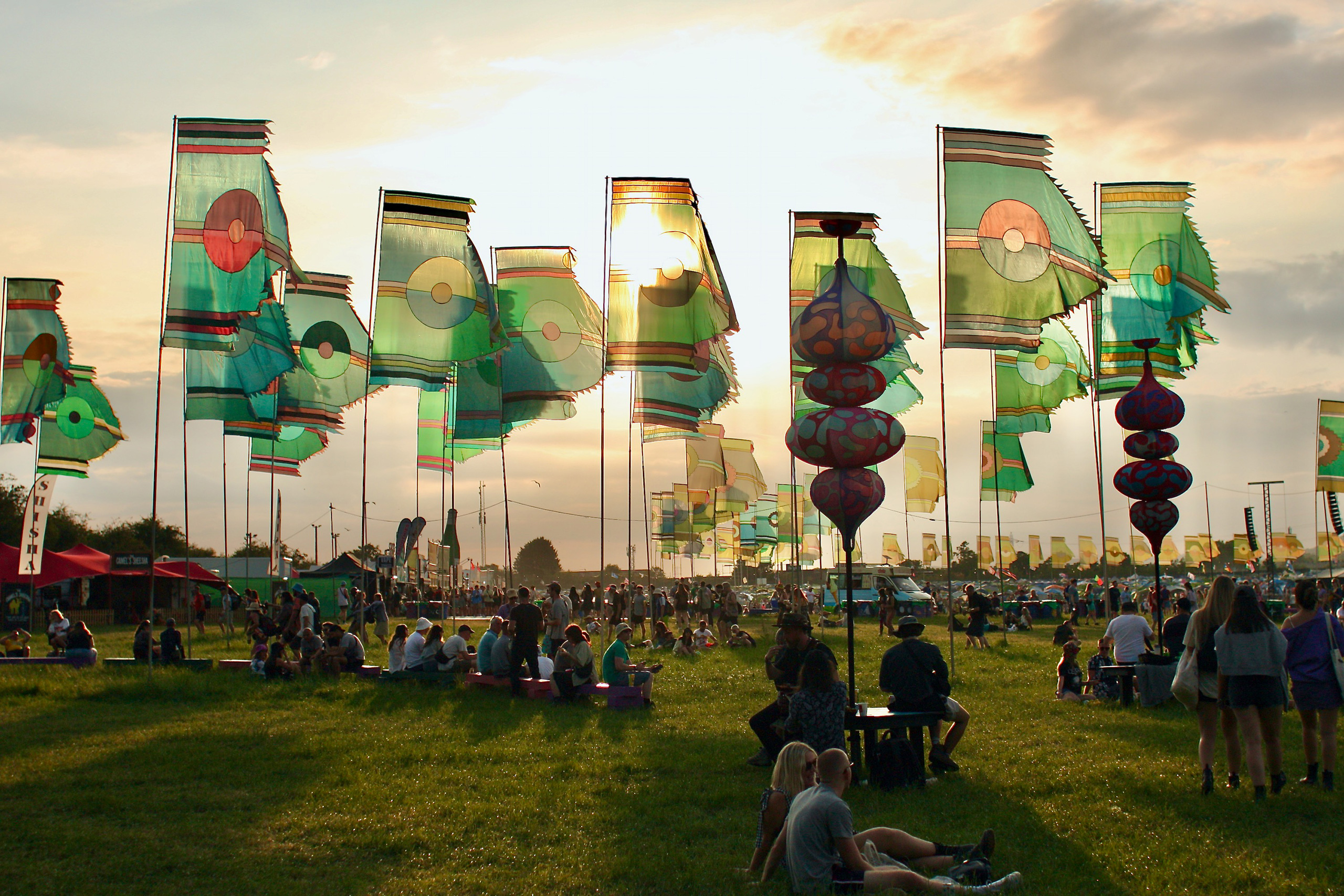 Flags against the setting sun on the horizon